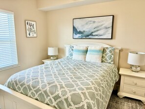 Guest Bedroom features a Queen bed and table lamps for nighttime reading.