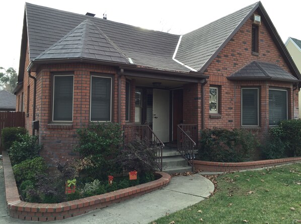 Our House. The Guest House is accessed from the side gate. 