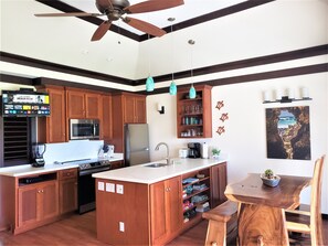 New kitchen with custom cabinets, quartz counters & stainless steel appliances.

