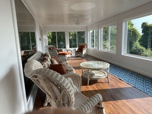 New three season porch off LR.  Lots of windows with screens-great for breezes!