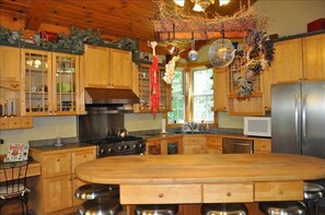 Gourmet kitchen w/Viking Stove and island.