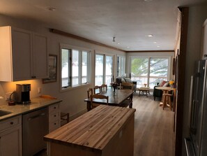 View of dining and sitting area from kitchen. 