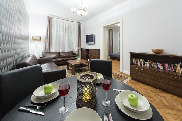 Living room with satellite TV and air-condition unit. 