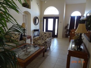 Spacious foyer filled with natural light and vaulted ceilings