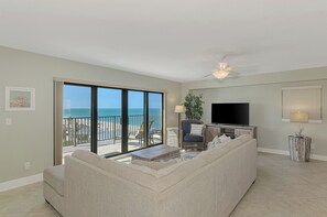 Living room with plenty of seating and smart TV.