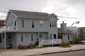 Front of house with relaxing Adirondack chairs/seating area, driveway for 4 cars