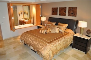 Master bedroom w/private bath, walk-in closet, spa tub & ocean view.