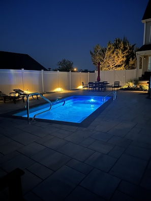Pool and patio night time view  
