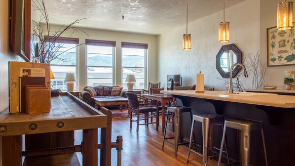 view from hallway to kitchen/ living room/ dining room