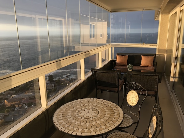 Ocean view terrace with folding glass closure system