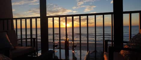 Relax with a  glass of wine while the sun sets over Indian Rocks Beach