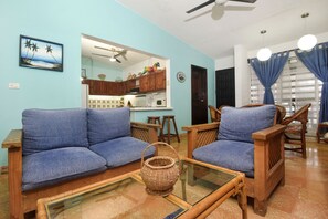 Living room with kitchen in the background 