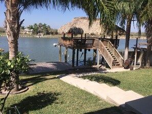 View of the Arroyo Colorado, fishing pier and palapa from the porch.