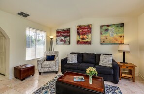 Bright and airy living room with vaulted ceilings and comfortable seating