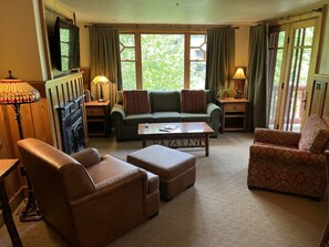 Living Room with Gas Fireplace & Flat Screen TV- Fantastic View of Grounds & Mts