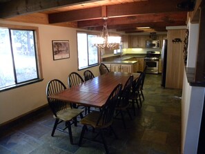 Dining area and kitchen, extra table and chairs available for larger groups