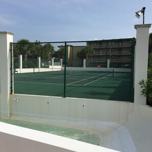 Tennis court behind home