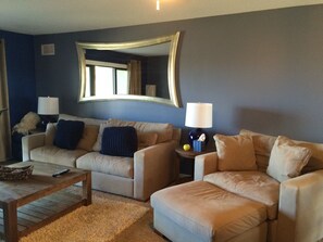 Sofa & chair-and-a-half w/ottoman for lounging. Pull-out full sized sleeper sofa