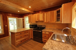 New in 2019 kitchen facing door to screened porch