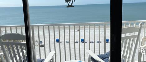 View of balcony, sandy beach and gulf from living room
