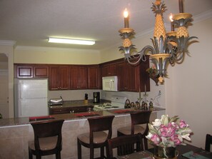 kitchen with Cherry Cabinets, Granite tops and breakfast bar.