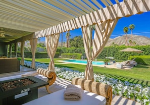 Relax in the 80 foot long Veranda overlooking the pool