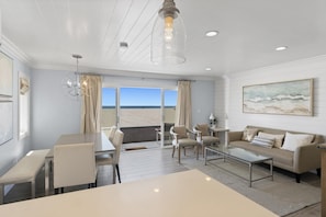 The open floor plan, which includes living/dining/kitchen areas, allows for easy group hangouts and unparalleled ocean views!