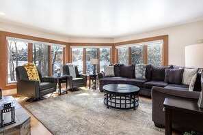 Large living room with river views-large TV/DVD, gas fireplace and games/movies