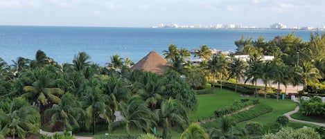 The view from the terrace: the gardens, pool area and beach/ocean