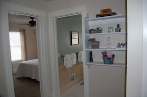 View from hallway into bathroom and bedroom #3