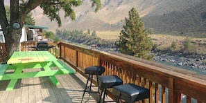 Relax on our big deck that overlooks the beautiful Salmon River