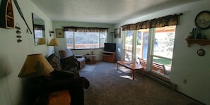 Living Room with beautiful views of the Salmon River and huge lawn