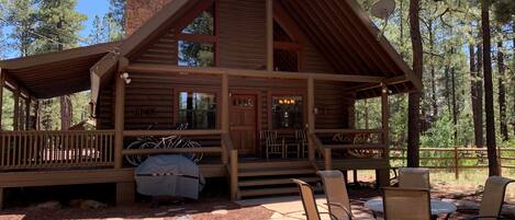 Summer time in the cool pines with nice flagstone patio to enjoy the forest view