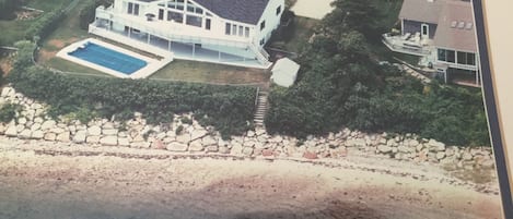 Aerial view of our home, swimming pool, upper & lower decks, steps downto Harbor