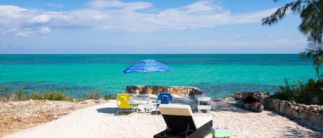 Sun yourself on our beautiful sand terrace. Use the stairs to enter the ocean.