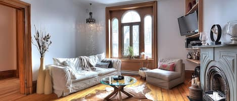 Living room with beautiful 10 ft ceiling window!