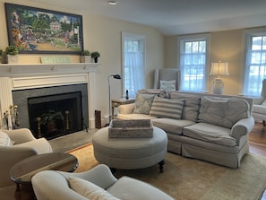 Swivel chairs can face sofa for conversation, or turn for TV viewing.