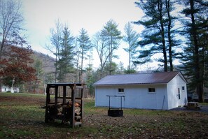 The spacious back yard has a custom-built fire pit