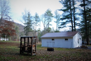 The spacious back yard has a custom-built fire pit