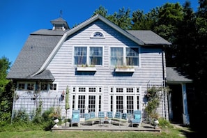 front view w/ sunny sitting area
pool to the left basketball court to the right