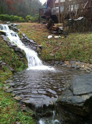 Ponds connected by waterfall fed by mountain stream