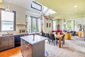 Living, dining & kitchen in the upper part of the duplex. Room for all to hang out.