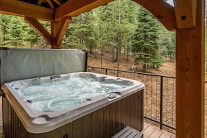 Soak it up in the hot tub with forest and lake views.