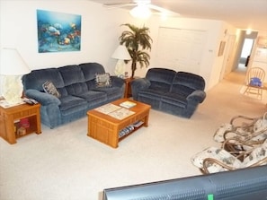 Living room and overlooking passageway to bedrooms