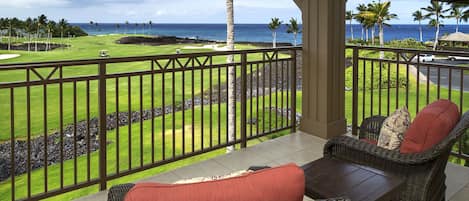 Cushioned seating on the private lanai of the primary bedroom of this Waikoloa Hawai'i vacation rental.