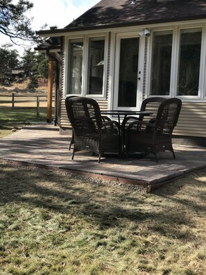 Patio off sunroom is a great spot for enjoying a meal in the mountain air.