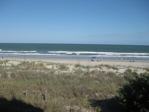 The view from one of the four captain chairs on the main level beach front porch