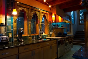 beautiful architectural piece from India and custom torquoise tile backsplash. 

