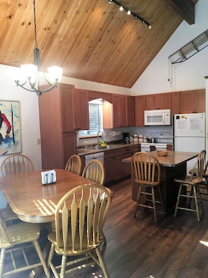 Updated kitchen and dining area.  Table seats 8+ and island seats 3.