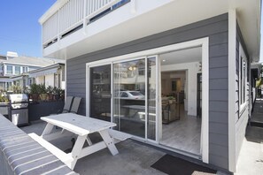 Designated patio table, seating and umbrella for this downstairs unit, along with BBQ grill. Ocean views of the 29th Street beachfront and boardwalk, just a half block away.
                